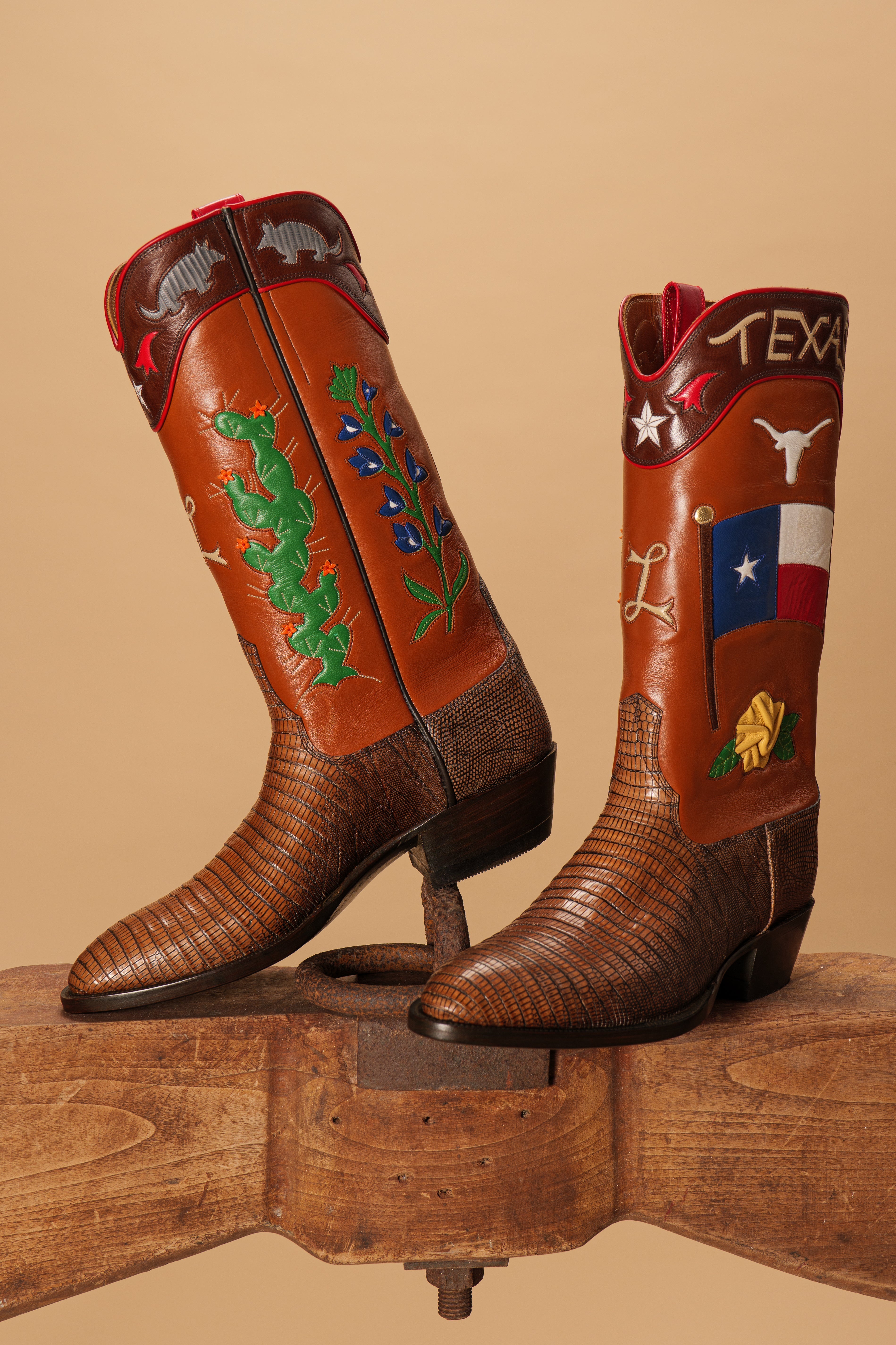 Custom handmade cowboy boots by Parker Boot Company featuring Texas-themed inlays, lizard vamp, and bespoke stitching—designed and crafted in Texas.