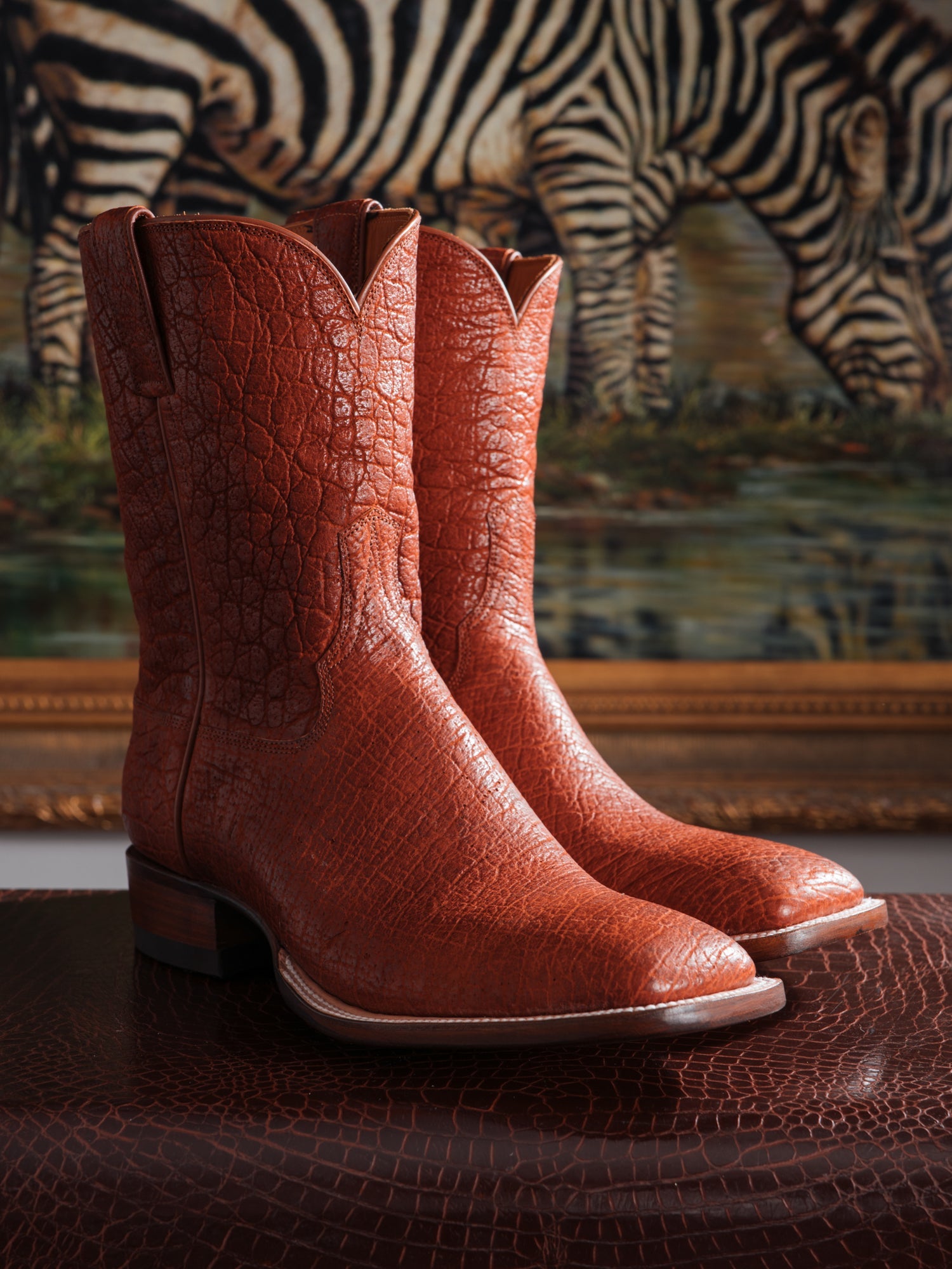 Custom cowboy boots handcrafted from a rare exotic hide, featuring natural hornback texture, bespoke stitching, and premium craftsmanship by Parker Boot Company.