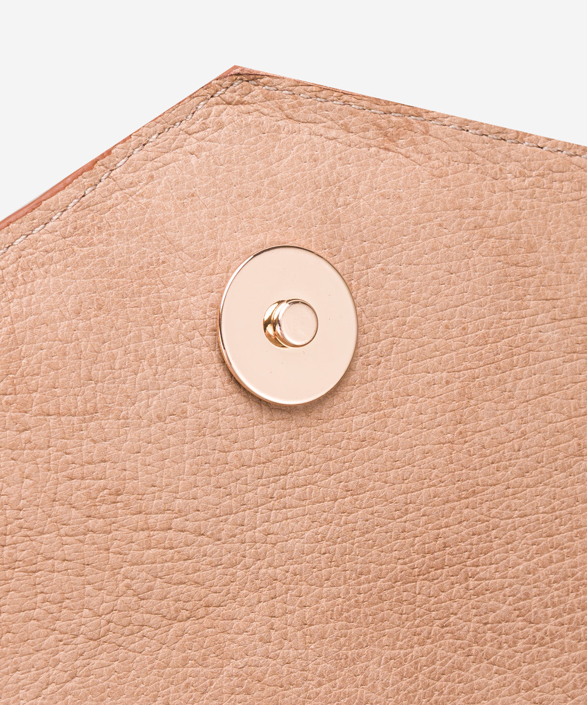 Close view of brown ostrich leather on the Catalina clutch
