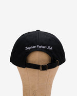 Back of the black Flying Z Ball Cap with white detailing, showing the adjustable closure