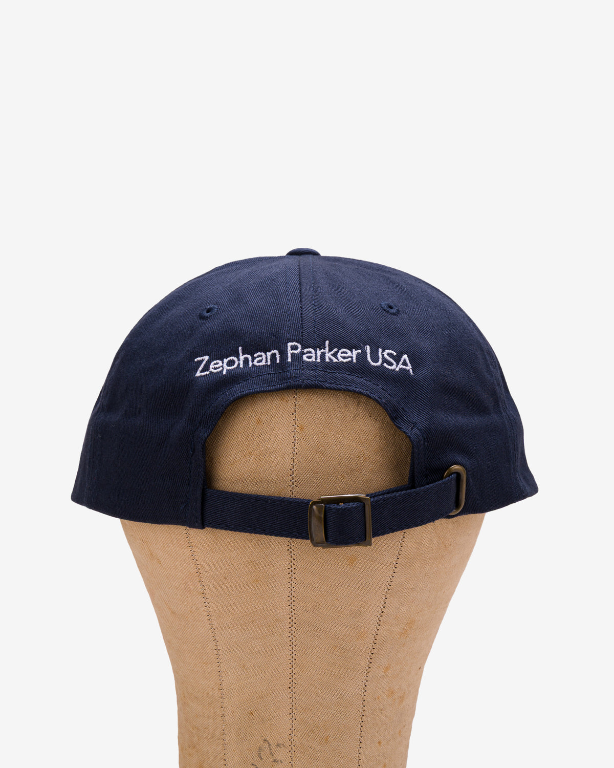 Back of the navy Flying Z Ball Cap showing the adjustable closure