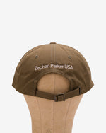 Back of the olive Flying Z Ball Cap showing the adjustable closure