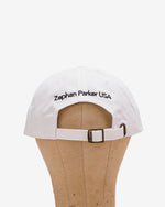 Back of the white Flying Z Ball Cap with black detailing, showing the adjustable closure
