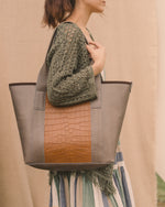 The Pecos Exotic Tote carried on the shoulder, calf leather with alligator accents